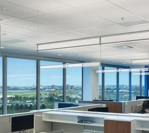 Suspended Linear LED Fixture with Transparent Vertical Anidolic Optics
