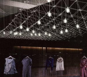 Architectural Statement Chandelier with Suspended Trapezoid Framework, Clear Glass LED Spheres, and Silver Metal Construction
