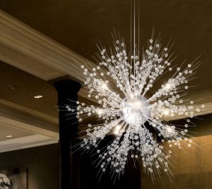 Modern LED Chandelier with Floating Glass Orb and Radiating Crystal Snowflake Design for Dramatic Interiors