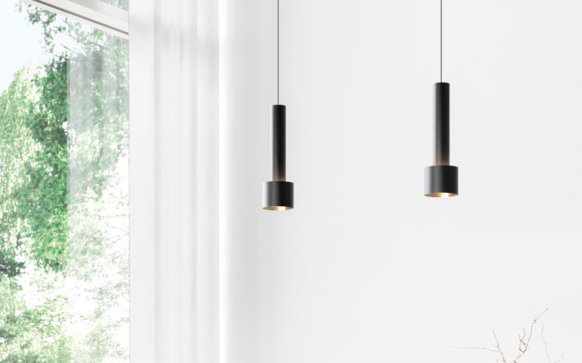 Architectural Pendant Light with Cylindrical Housing and Up-Glow Highlighting