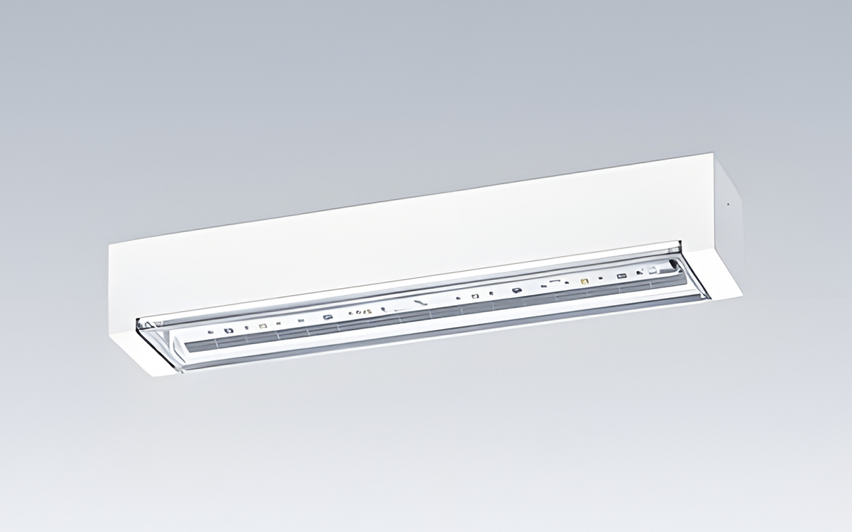 Dual-Function Wall and Ceiling Emergency Luminaire with Integrated Safety Sign Functionality