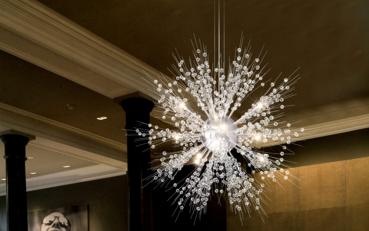 Modern LED Chandelier with Floating Glass Orb and Radiating Crystal Snowflake Design for Dramatic Interiors