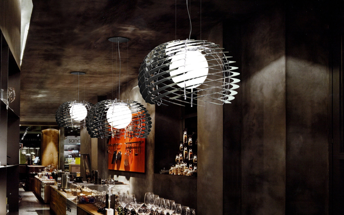 Modern Spiral Chandelier with Curved Metal Bands and Central LED Globe for Dynamic Interior Lighting