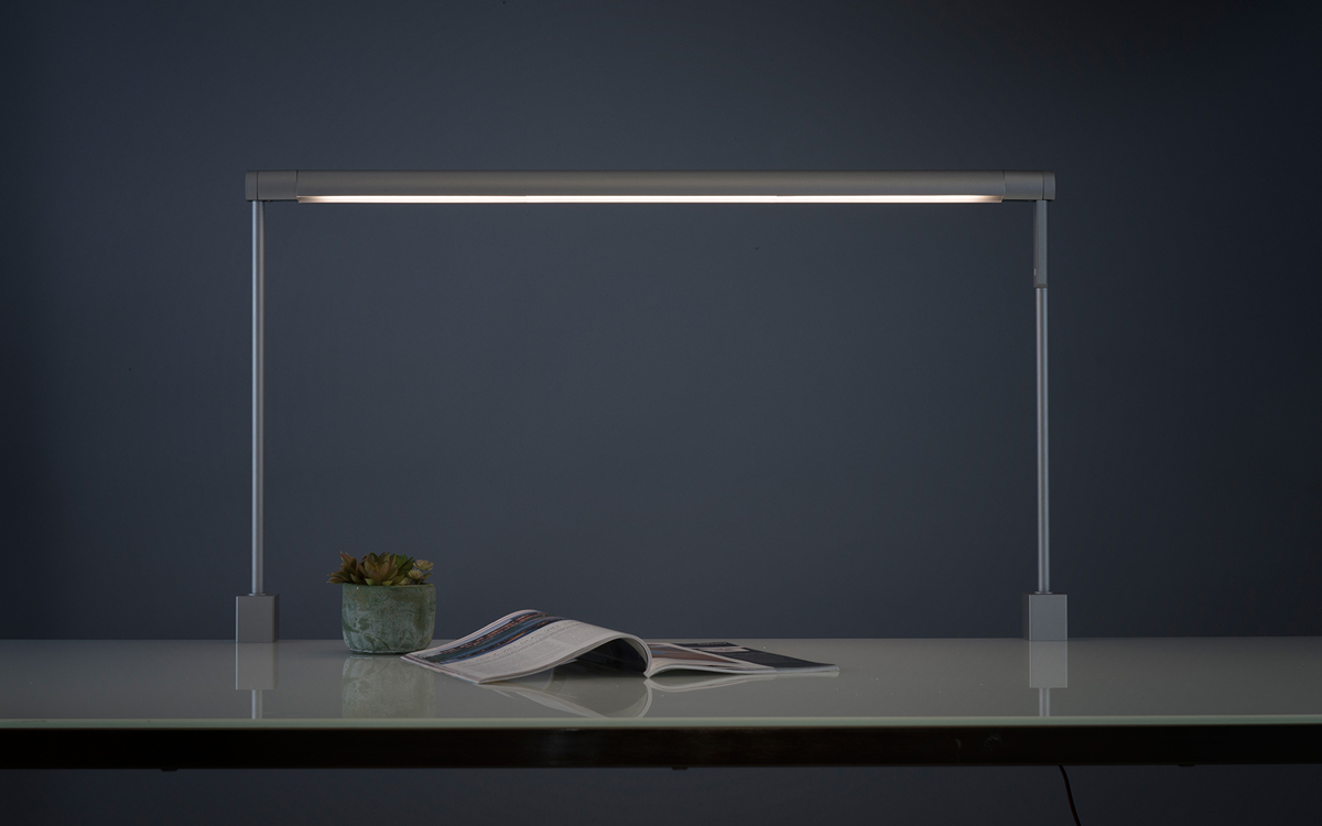 Overhead LED Light Bar for Task and Ambient Desk Lighting in Contemporary Workspaces