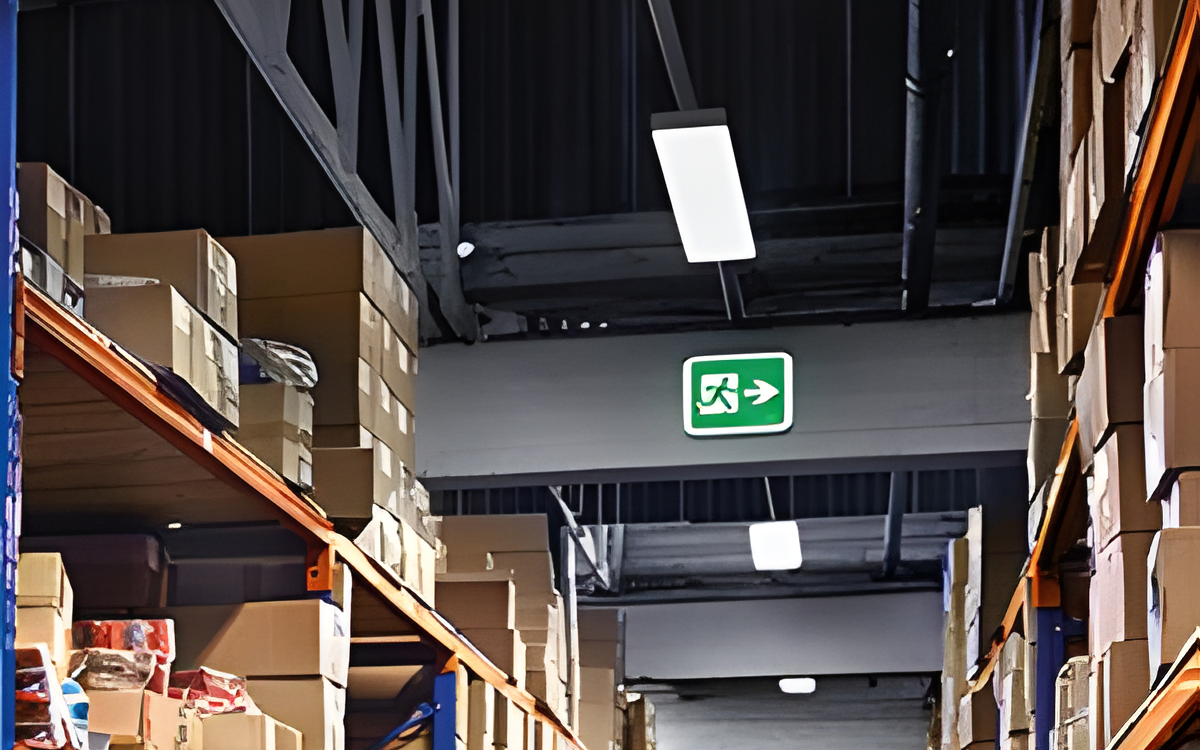 Wall-Mounted Emergency Exit Sign With High Visibility and DIN 4844 Compliance