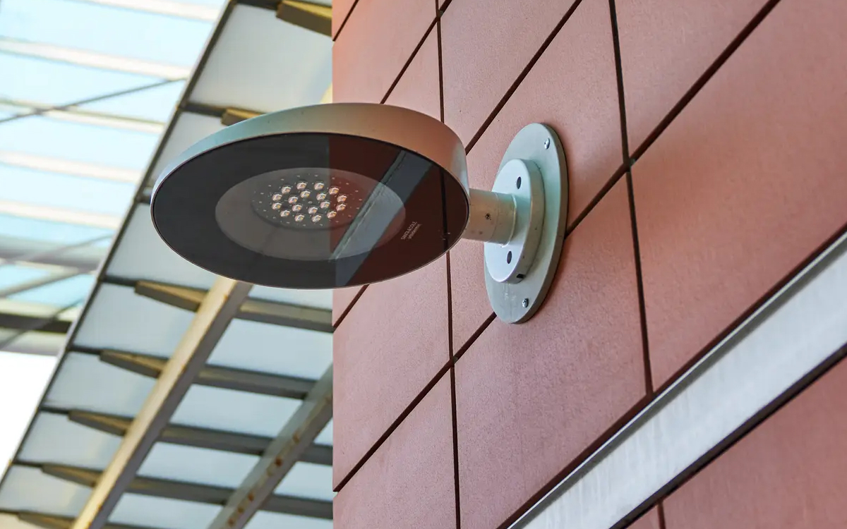Wall Mounted LED Fixture with Integrated Dimmable Driver for Commercial and Public Outdoor Spaces